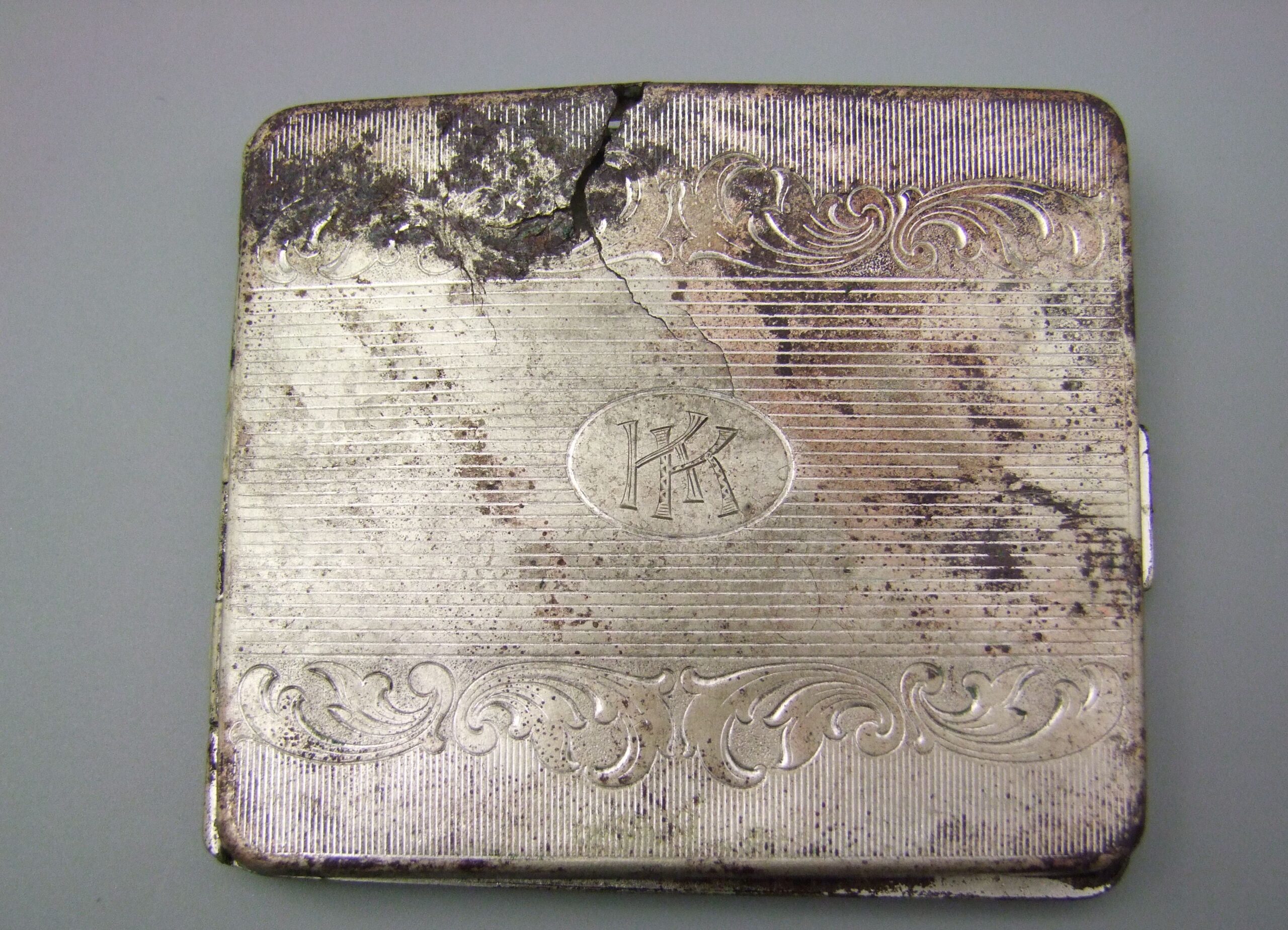 Cigarette case, property confiscated from prisoners. Condition after conservation.