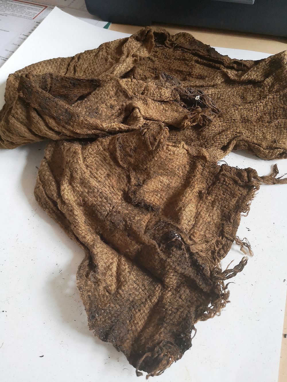 A scarf belonging to one of the execution victims. Condition before conservation.