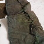 A fragment of a jacket belonging to one of the victims of the execution. Condition before conservation.